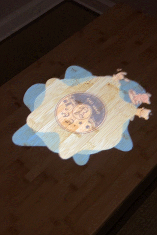 Opening animation of Bibi and friends surfing in a circle projected onto a table
