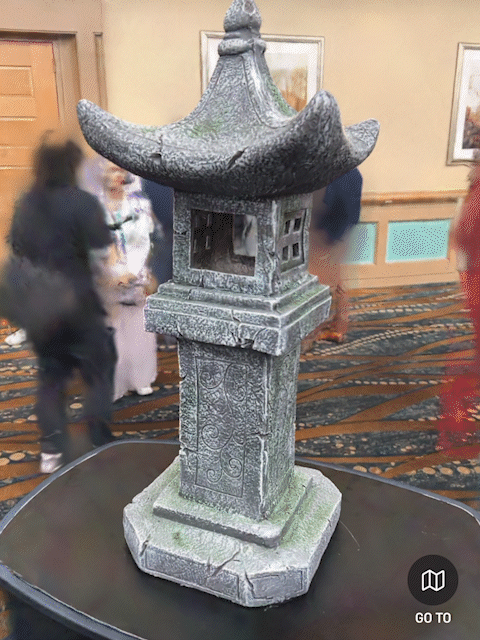 3D Gaussian splat reconstruction of a statue display created with Scaniverse on a phone